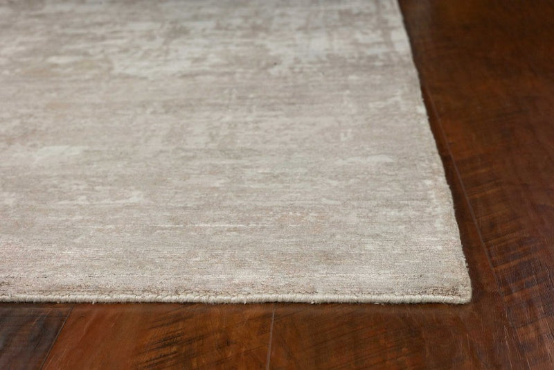 5' X 7' Beige And Ivory Abstract Hand Loomed Area Rug