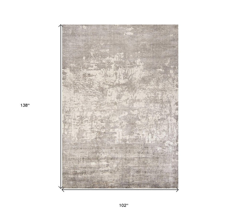 5' X 7' Beige And Ivory Abstract Hand Loomed Area Rug