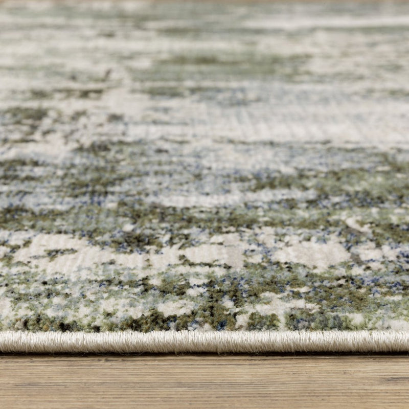 3' X 5' Green Blue Grey Ivory And Brown Abstract Power Loom Stain Resistant Area Rug