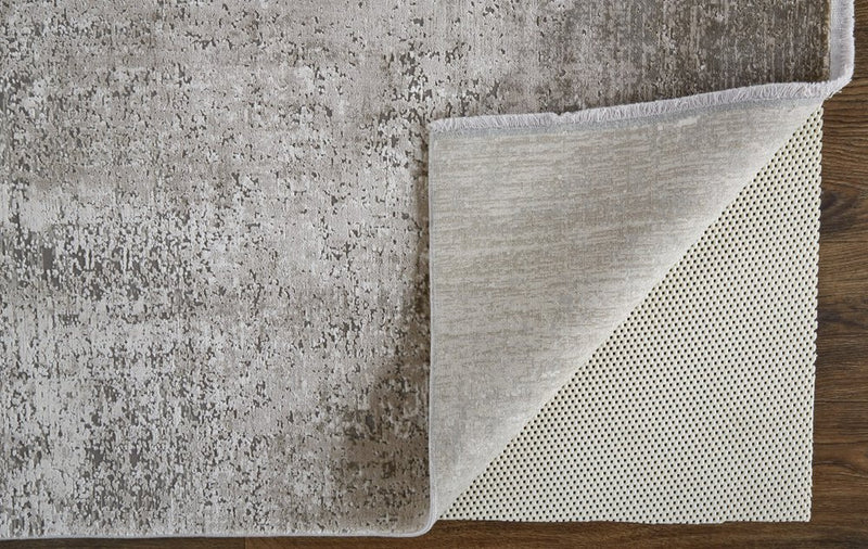 3' X 5' Tan and Ivory Abstract Power Loom Distressed Area Rug With Fringe