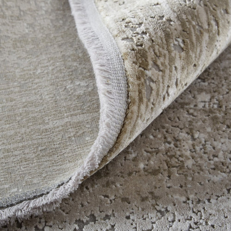 3' X 5' Tan and Ivory Abstract Power Loom Distressed Area Rug With Fringe
