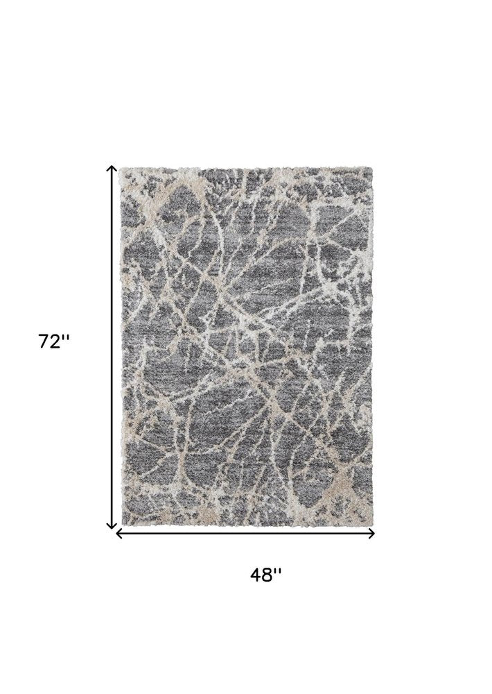 5' X 8' Gray And Ivory Abstract Power Loom Stain Resistant Area Rug