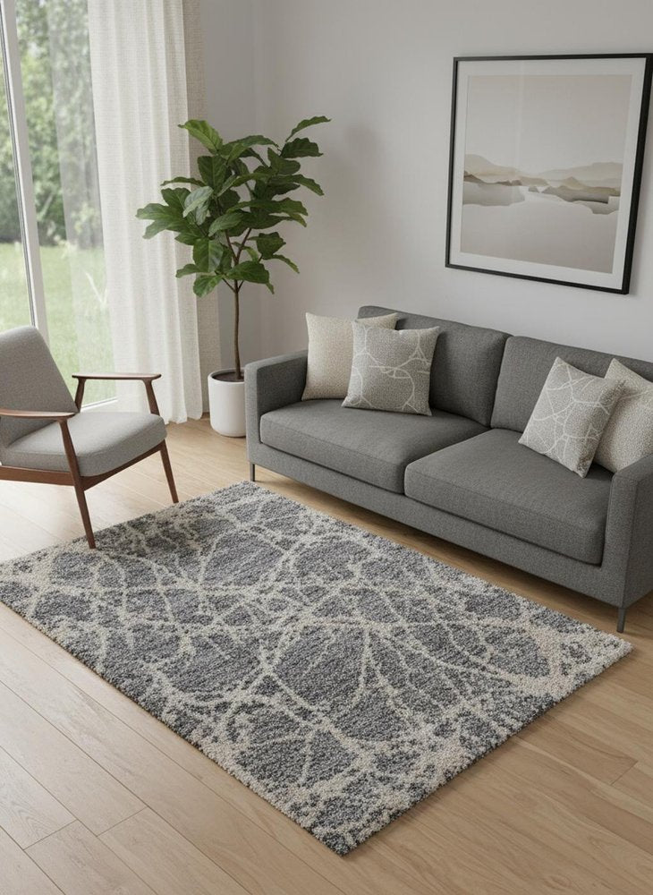 5' X 8' Gray And Ivory Abstract Power Loom Stain Resistant Area Rug
