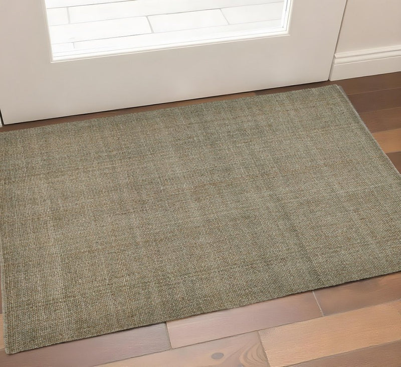5' X 8' Tan And Green Hand Woven Area Rug