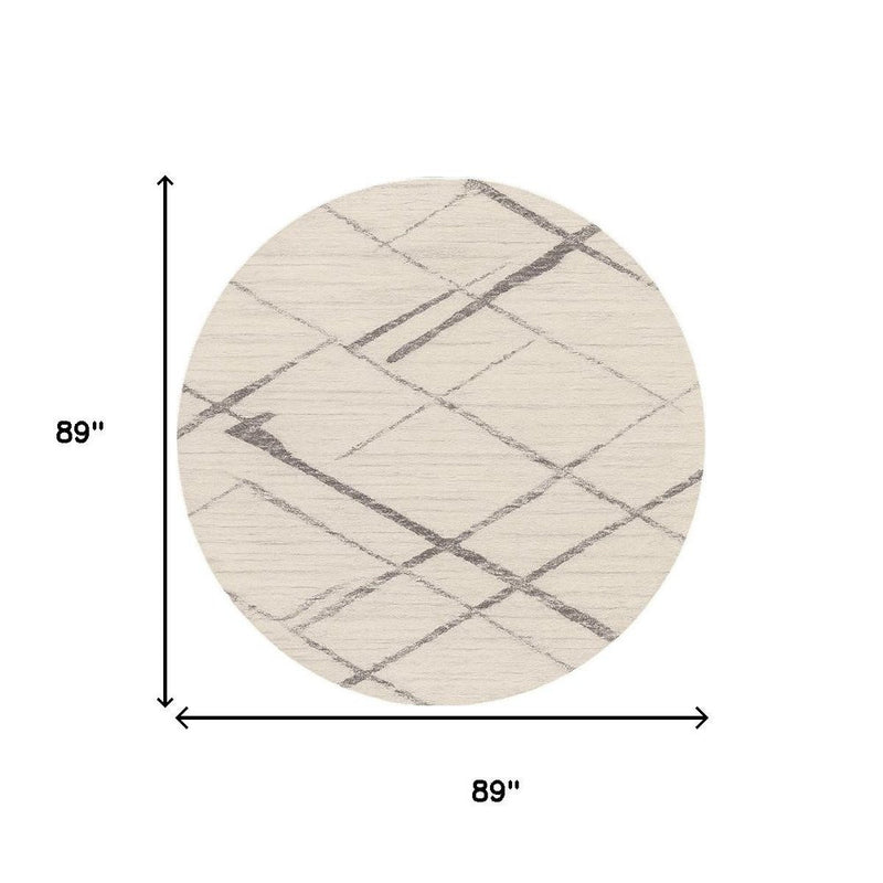 8' Beige and Gray Abstract Distressed Round Rug