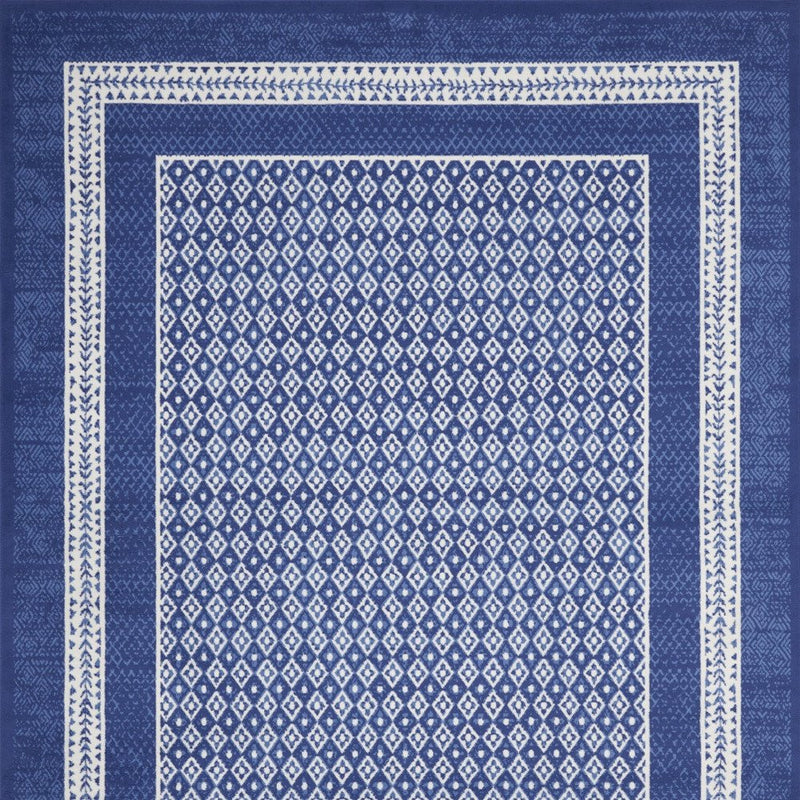 8' X 12' Blue And Ivory Geometric Distressed Area Rug