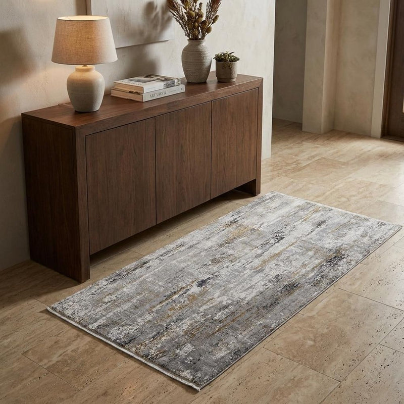 7' X 10' Gray Ivory and Gold Abstract Power Loom Area Rug With Fringe