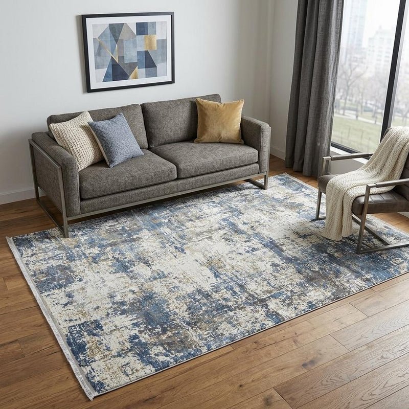 3' X 5' Ivory Tan and Blue Abstract Power Loom Area Rug With Fringe