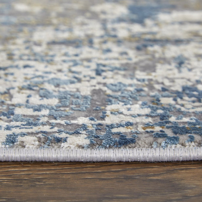 3' X 5' Ivory Tan and Blue Abstract Power Loom Area Rug With Fringe