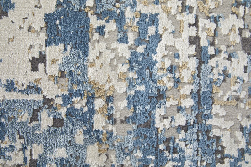 3' X 5' Ivory Tan and Blue Abstract Power Loom Area Rug With Fringe