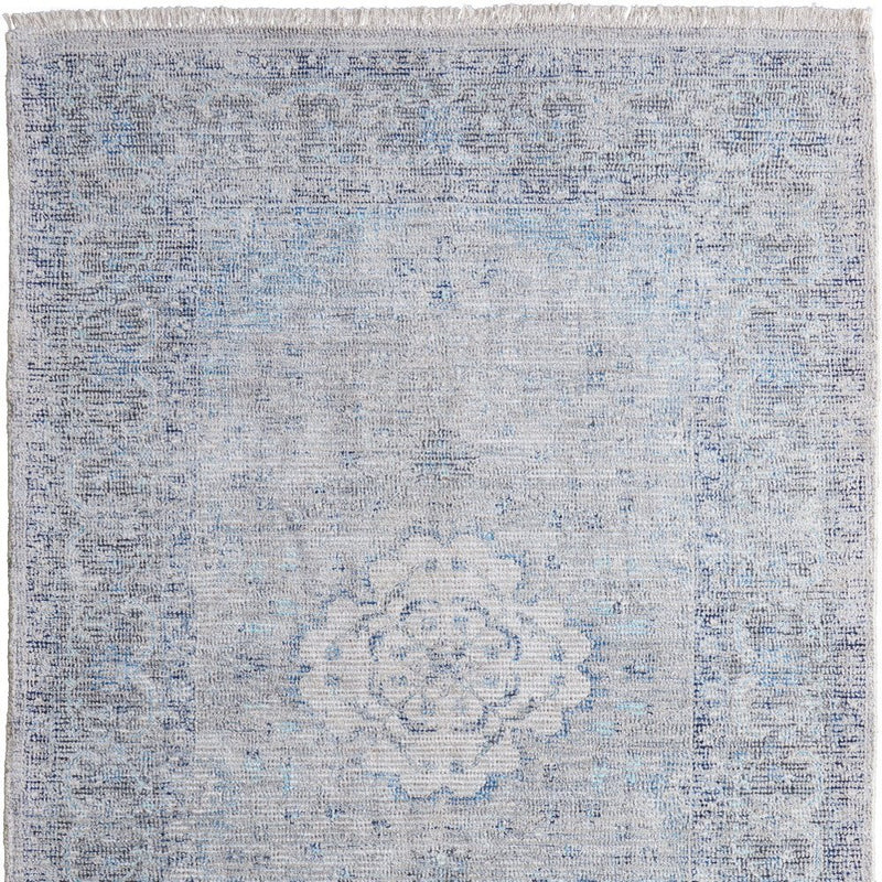 4' X 6' Gray Blue and Ivory Oriental Hand Woven Distressed Area Rug With Fringe
