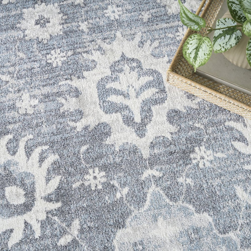 4' X 6' Blue Floral Power Loom Worn Faded Area Rug