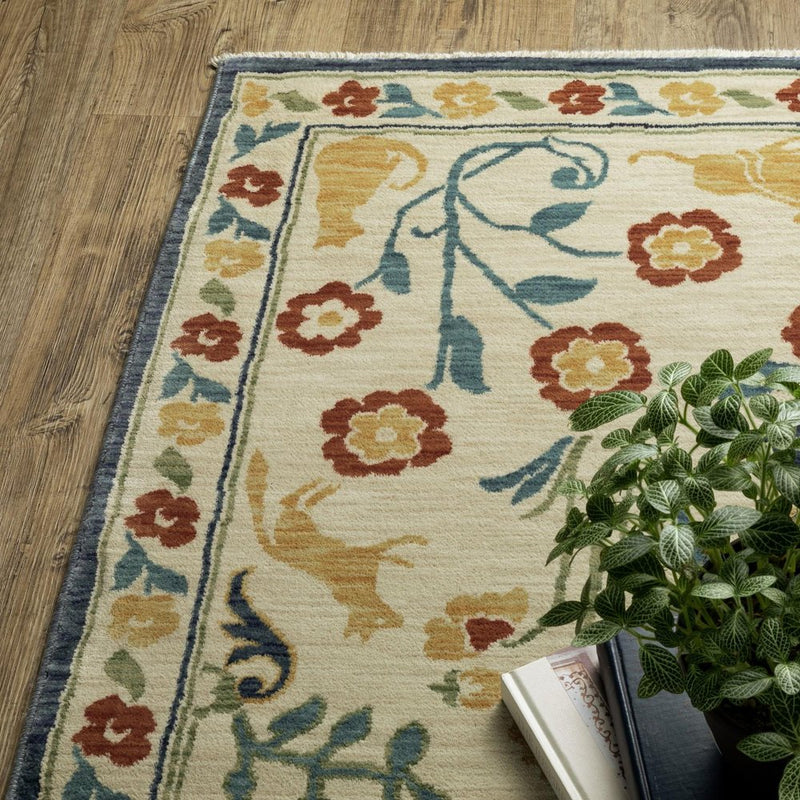 2' X 3' Ivory Orange And Yellow Oriental Area Rug With Fringe