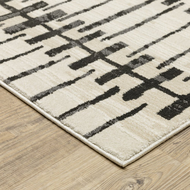 5' X 8' Beige And Black Geometric Area Rug