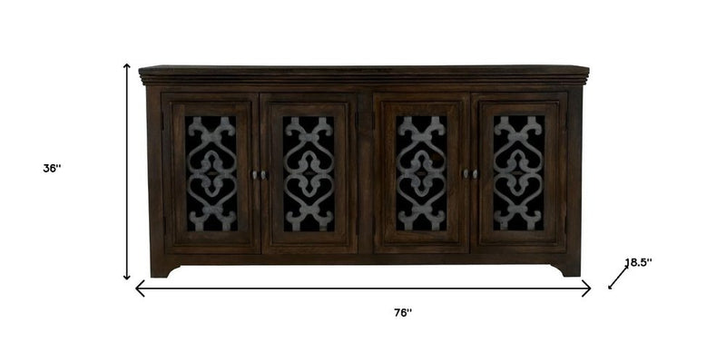 76" Brown Distressed Soldi Wood And Iron Carved Scrollwork Sideboard With Four Glass Doors