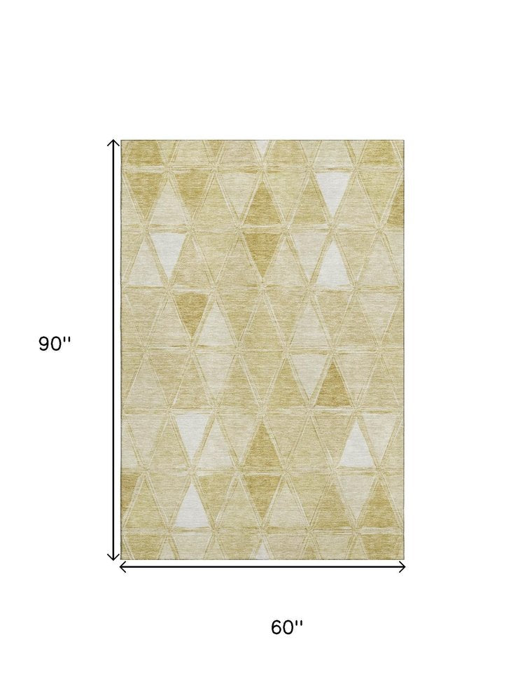5' X 8' Gold And Ivory Geometric Washable Area Rug With UV Protection