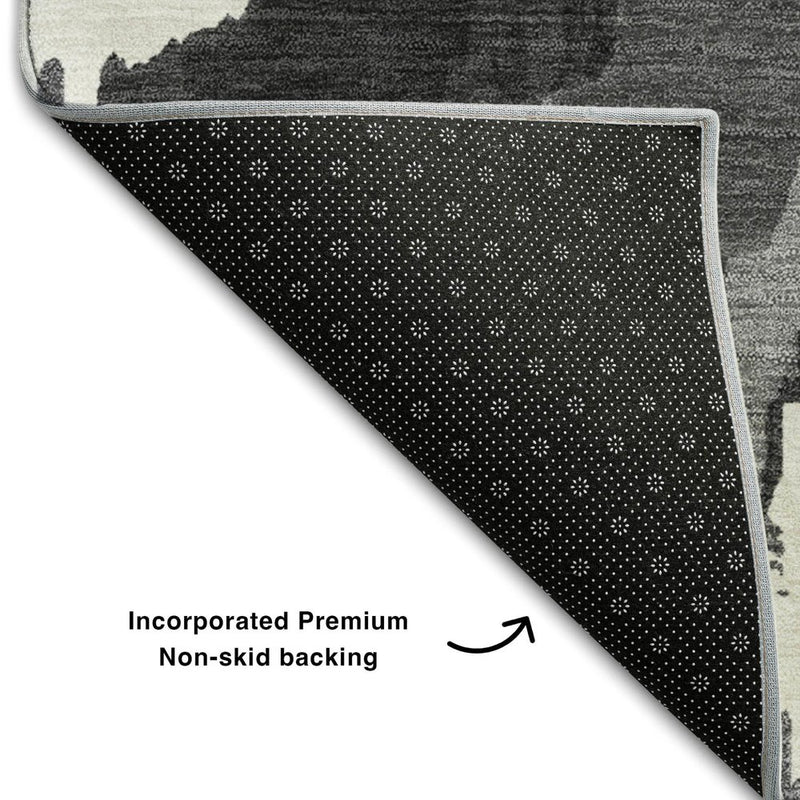 5' X 8' Black And Ivory Abstract Washable Area Rug With UV Protection