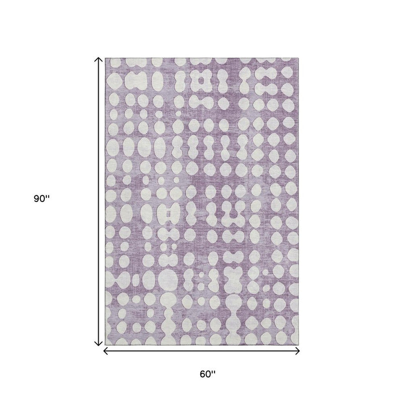 5' X 8' Purple And Ivory Polka Dot Washable Area Rug With UV Protection