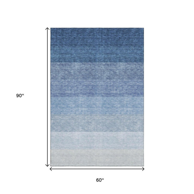 5' X 8' Blue And Ivory Ombre Washable Area Rug With UV Protection