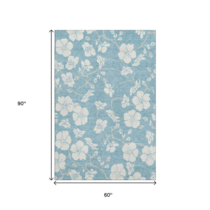 5' X 8' Sky Blue And Ivory Floral Washable Area Rug With UV Protection