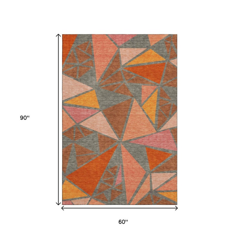 5' X 8' Rust Orange And Salmon Geometric Washable Area Rug With UV Protection