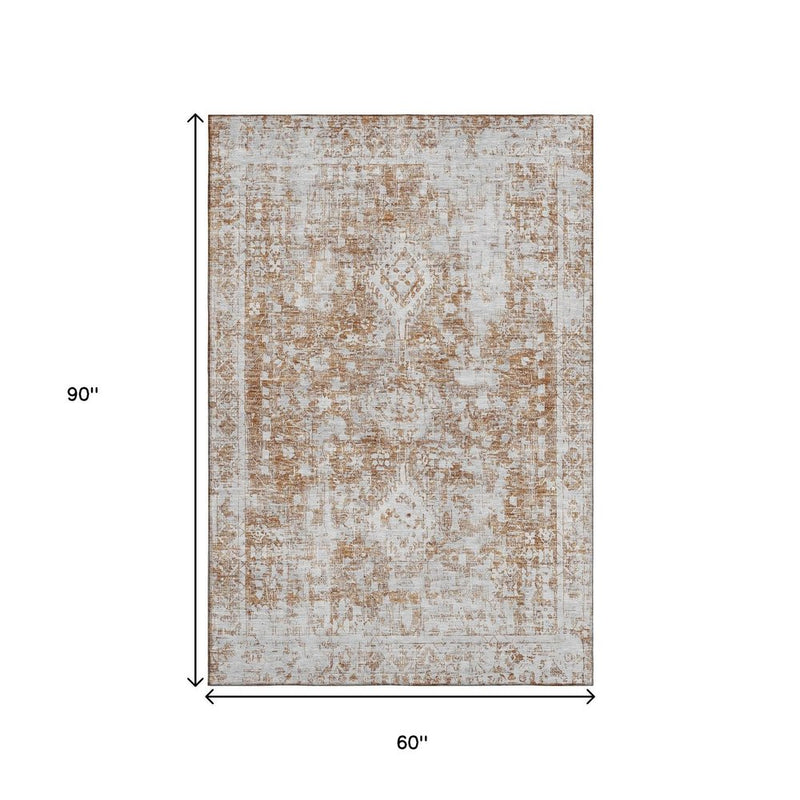 5' X 8' Terra Cotta And Silver Oriental Washable Area Rug With UV Protection