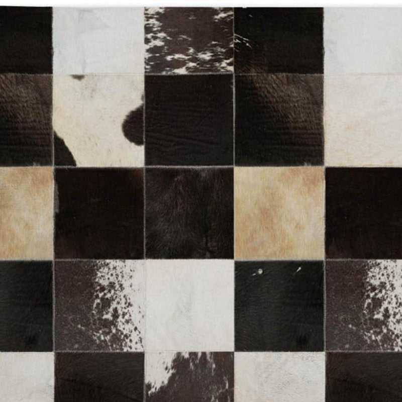 5' X 8' Black And Ivory Animal Print Shag Washable Area Rug With UV Protection