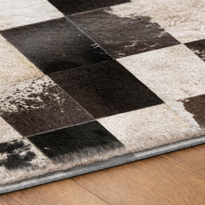 5' X 8' Black And Ivory Animal Print Shag Washable Area Rug With UV Protection