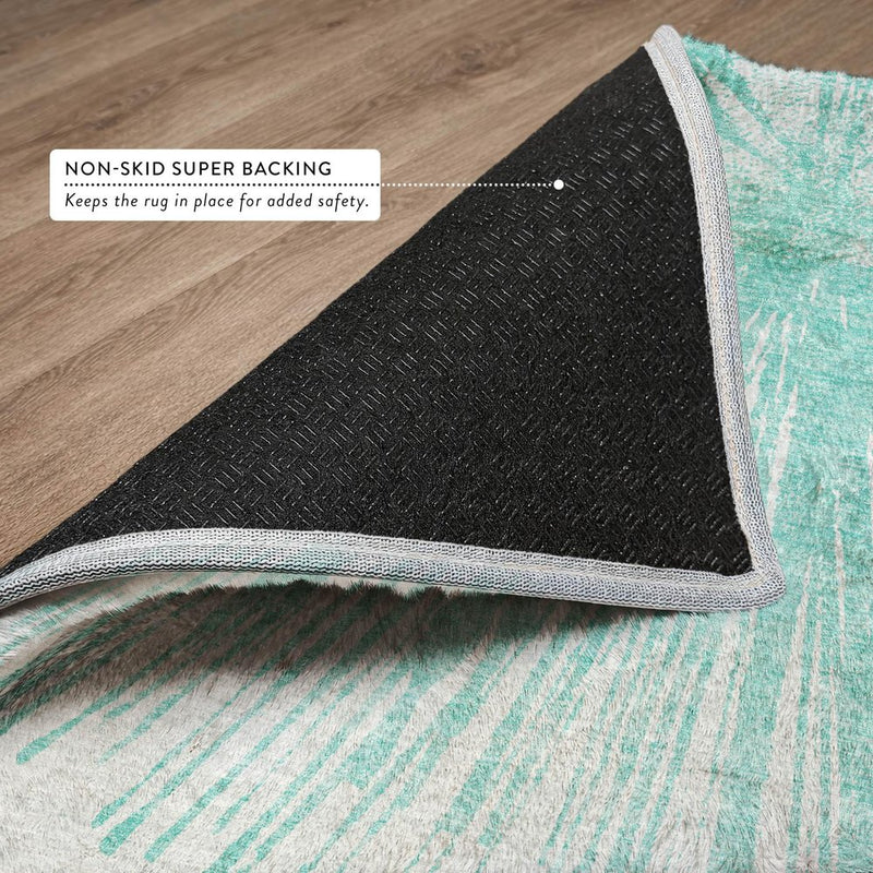 5' X 8' Teal And Ivory Abstract Shag Washable Area Rug With UV Protection