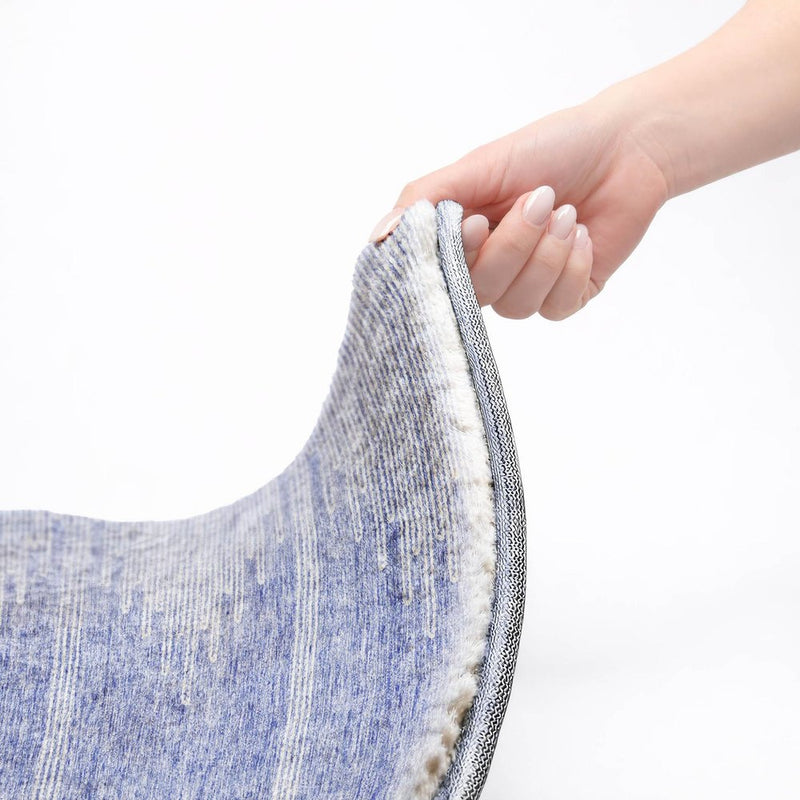 8' Denim Blue And Ivory Abstract Shag Washable Round Rug With UV Protection
